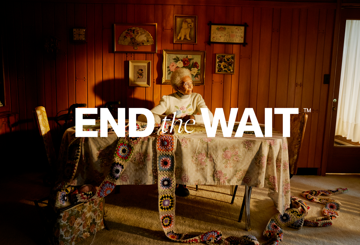 End the Wait logo over Woman waiting with long knitted scarf