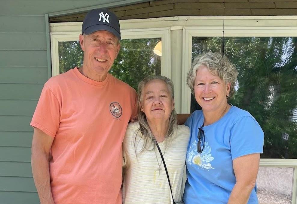 Man and two women standing together